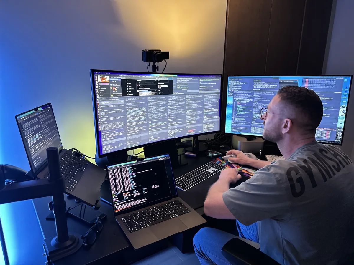 Peter Steinberger's desk setup — multiple monitors running parallel AI coding agents